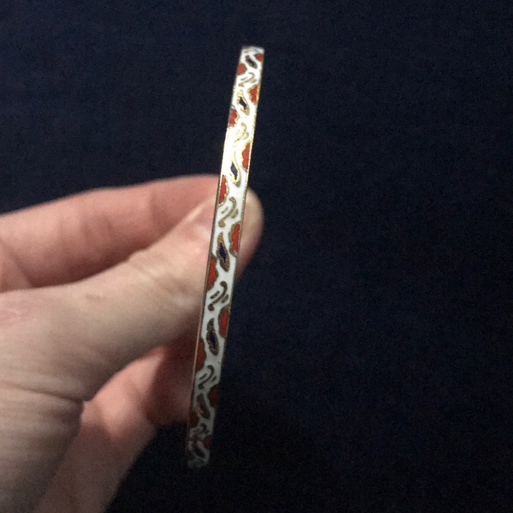 three metal bracelets